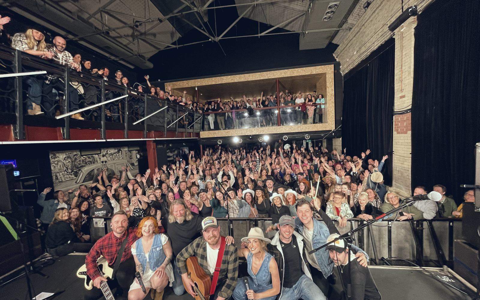 Nashville At Heart on stage with the audience behind them