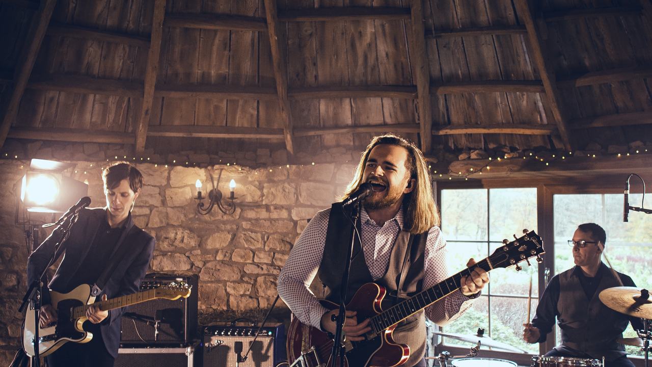 The Heartland playing in a stone walled room